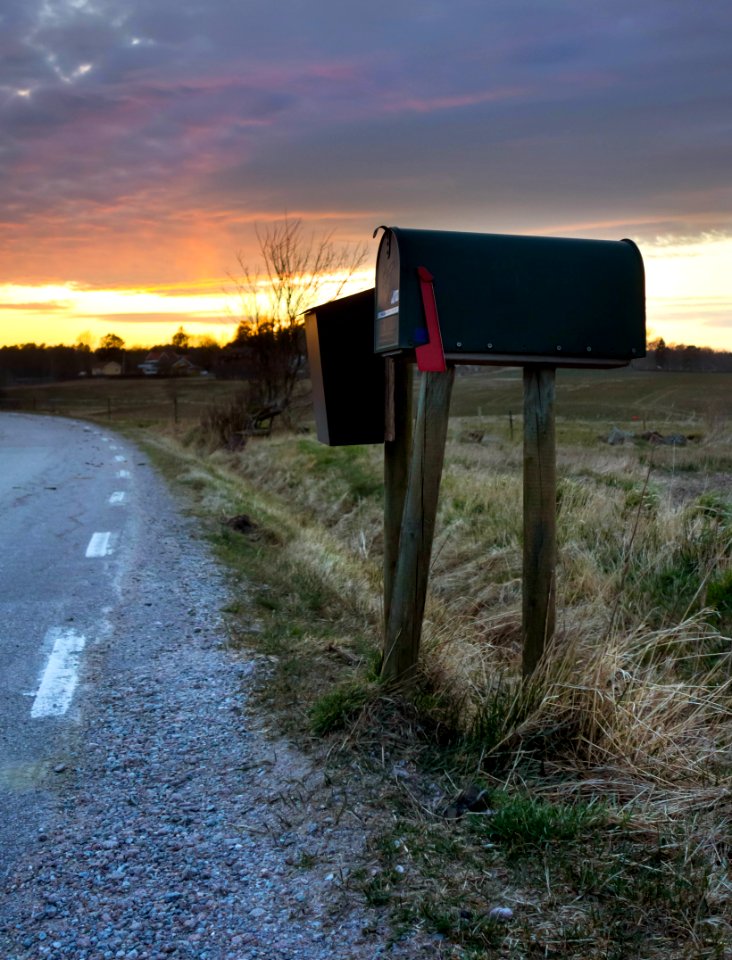 Letter boxes at sunset in Brastad