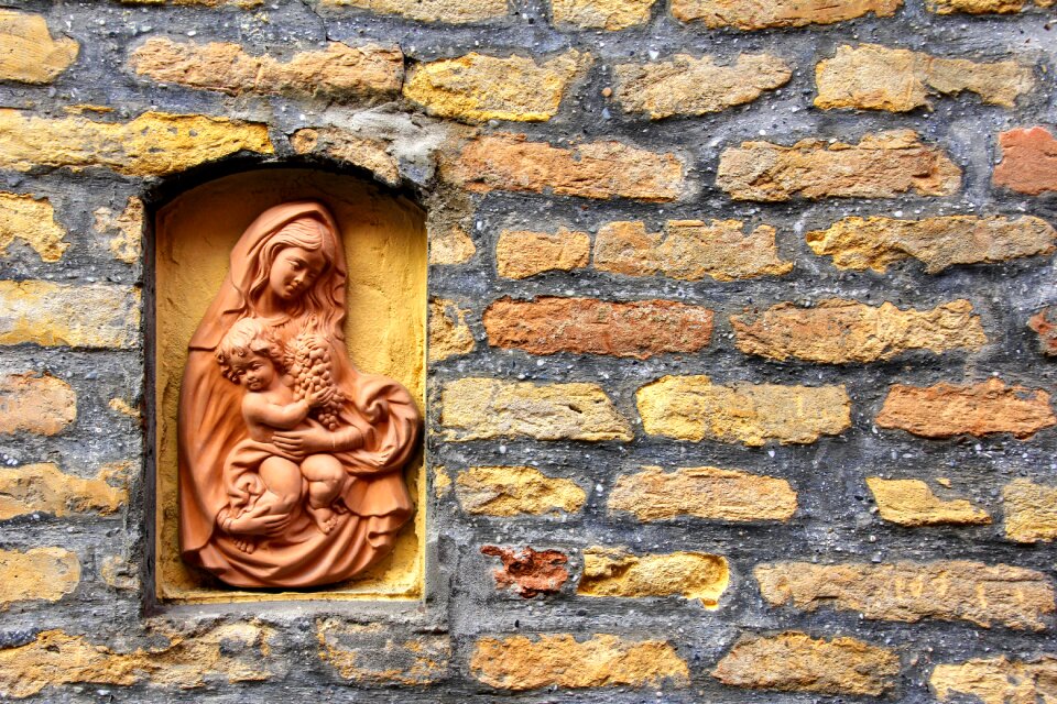 Madonna sculpture natural stone wall