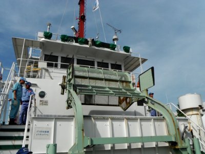 Lifted bucket of Beikurin the cleaning vessel of Japan Coast Guard