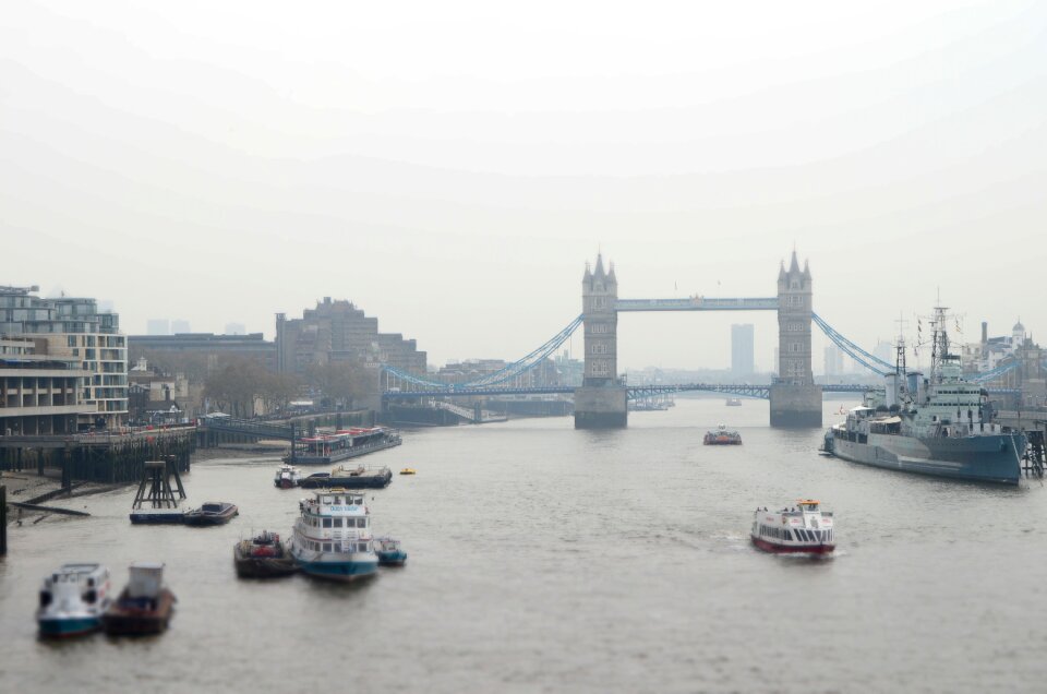 Rainy gray boat gray bridge