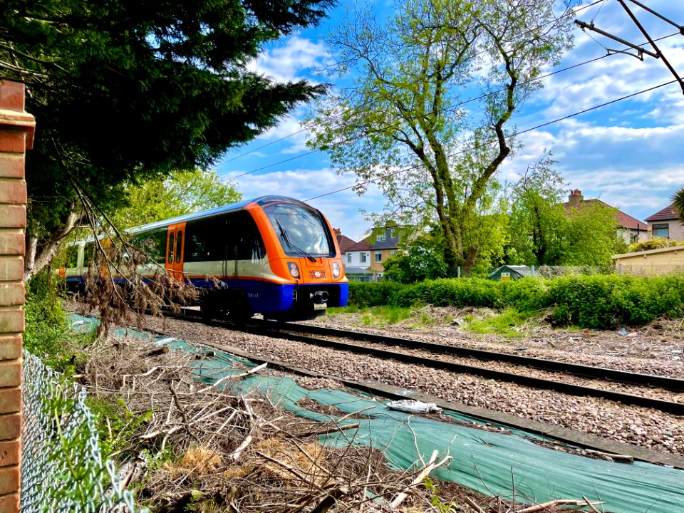 LO Class 710 passing Butts Lane FC near Emerson Park, 2021