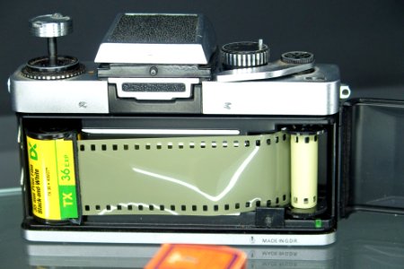 Loading 35mm film into old SLR camera photo