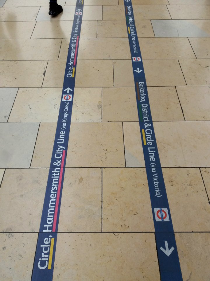 London - Paddington station, underground signs on the floor photo