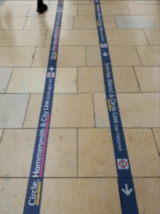 London - Paddington station, underground signs on the floor photo