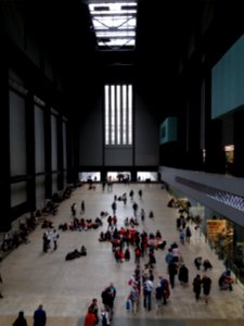 London - Tate Modern, turbine hall, people lying photo