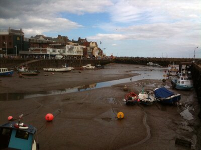 Boats harbour low tide photo