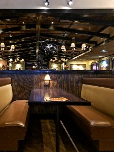 Longhorn Steakhouse Booth with Western Decoration photo
