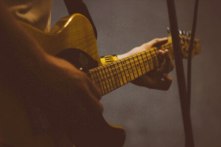 Player strings brown guitar photo