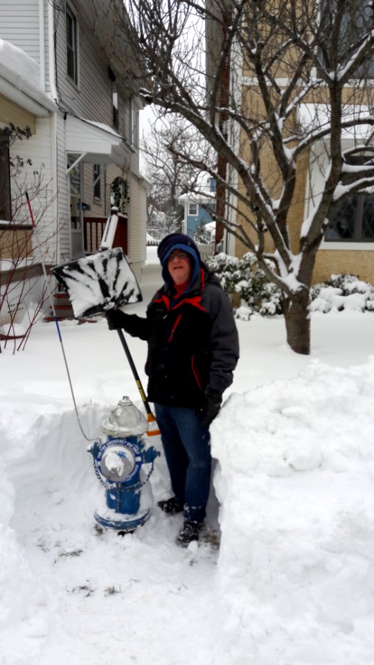 Local resident digs out fire hydrant after snowstorm in Summit New Jersey