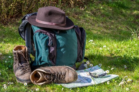 Hiking shoes hat backpack photo