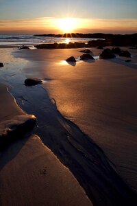 Rocks sand sea photo