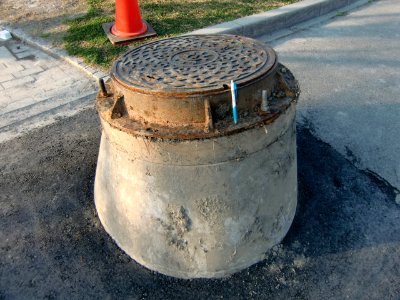 Manhole shows subsidence occurred by 2011 Sendai earthquake photo