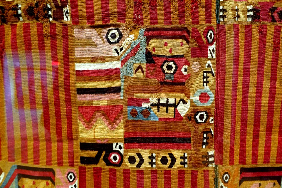 Man's tunic with three musicians, Peru, Wari style, 8th to 9th century AD, cotton and camelid hair, view 2 - Textile Museum, George Washington University - DSC09557