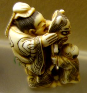 Man and child with mask netsuke - Fairbanks Museum and Planetarium - DSC04355
