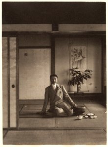 Man Sitting in Japanese House with Teapot and Cups by Adolf de Meyer 1900-1910