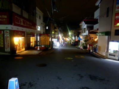 Main street in front of the main gate of Kansai University at night