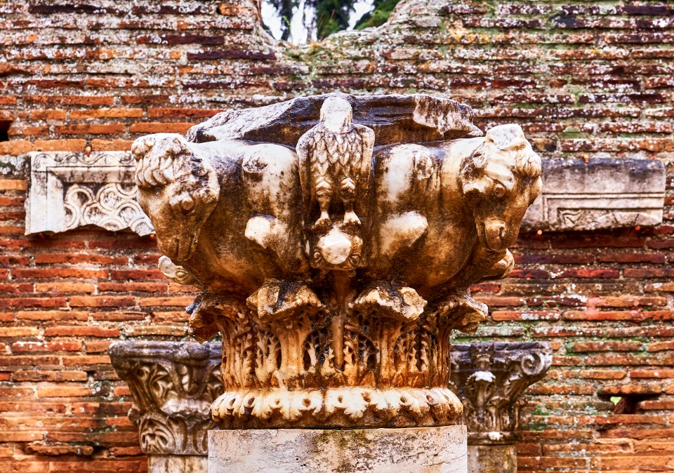 Marble capital with acanthus leaves, ram-heads and eagles in the courtyard of the Archaeological Museum of Sicyon on 8 April 2019