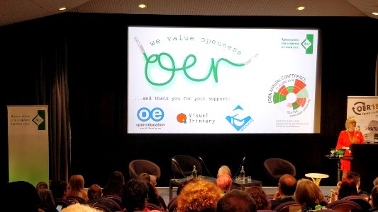Maren Deepwell welcomes attendees to OER18 conference