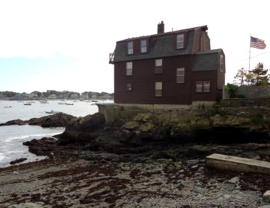 Marblehead Massachusetts harbor and flag and house and beach and boats photo