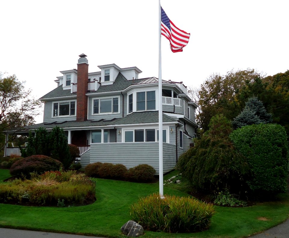 Marblehead Massachusetts house on peninsula with flag and shrubberies