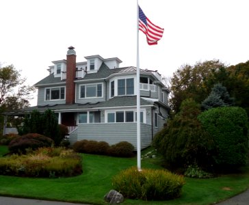 Marblehead Massachusetts house on peninsula with flag and shrubberies
