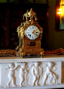 Mantel clock by Julien Le Roy, 1790, glass, ormolu, vitreous enamel, on chimneypiece by John Devall the younger, 1793, marble - Blue Drawing Room - Shugborough Hall - Staffordshire, England - DSC00336