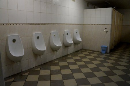 Mens restroom with urinals in Europe. This photo has been released into the public domain. There are no copyrights you can use and modify this photo without asking, and without attribution photo