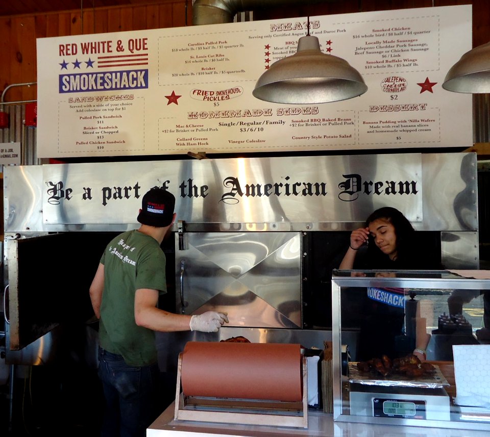 Menu board and food service personnel at Red White and Que restaurant in New Jersey