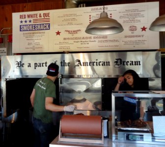 Menu board and food service personnel at Red White and Que restaurant in New Jersey