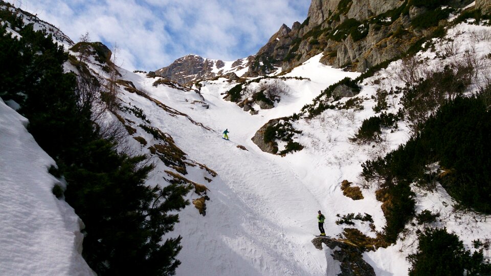 Skier skis downhill photo