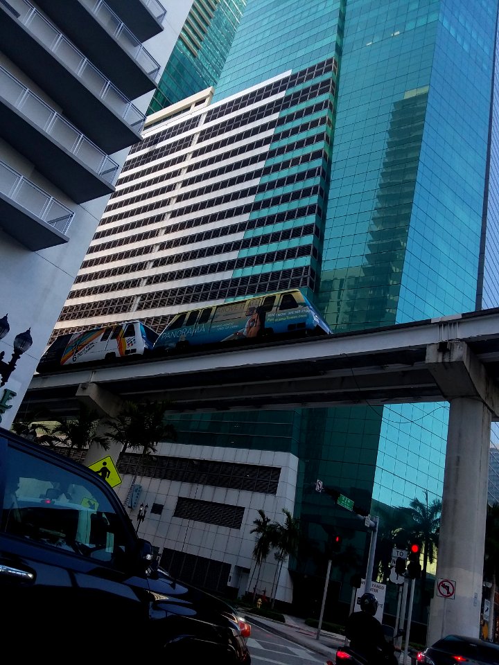 Metromover passes Wells Fargo Center building parking garage