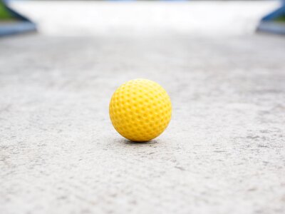 Checkered ball guide miniature golf