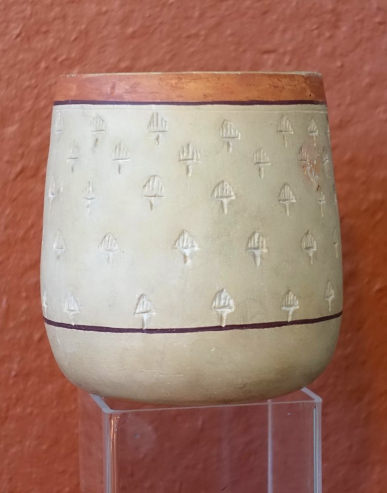 Meroitic bowl, largely restored, 500-400 BCE, thin metallic ware with cream slip and stamped design - Redpath Museum - McGill University - Montreal, Canada - DSC08124