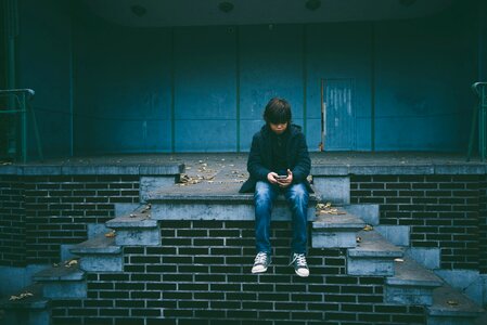 Sitting stairs young photo