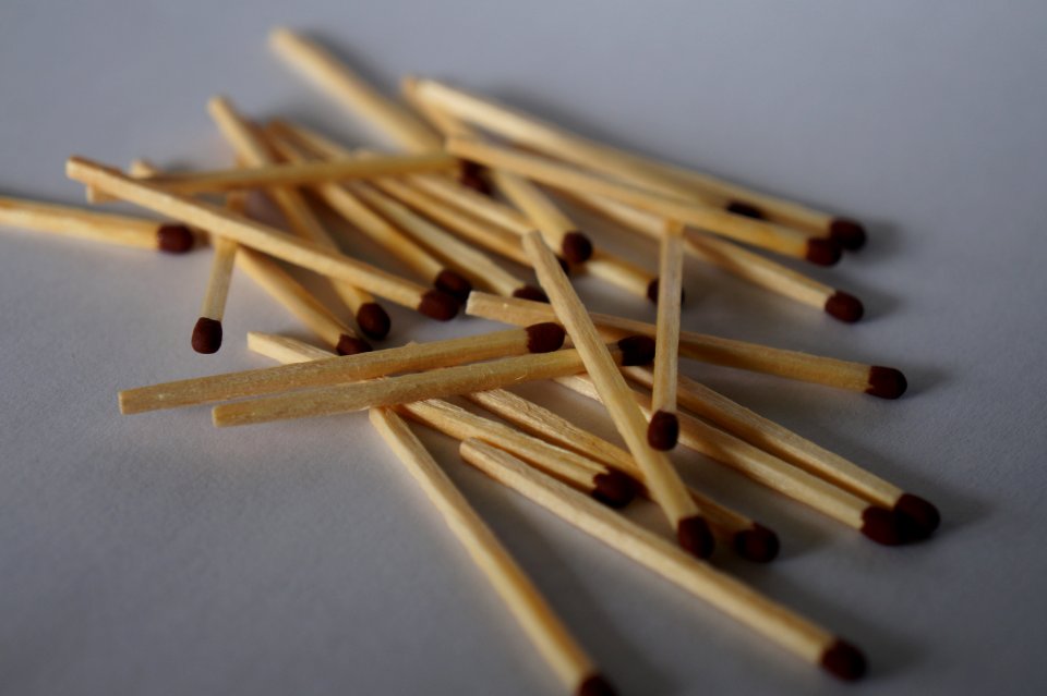 Matches scattered on white background (option 2 of 2)