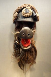 Mask, Liberia, Sapo people, early 20th century, wood, cowrie shells, leopard teeth, metal, cloth, Colobus monkey hide with hair, antelope horn - De Young Museum - DSC01054