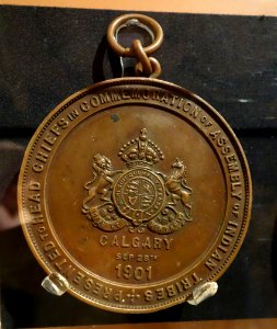 Medal commemorating visit of Duke and Duchess of Cornwall (later King George V and Queen Mary) to Siksika peoples near Calgary, 1901, view 1 - Glenbow Museum - DSC01090