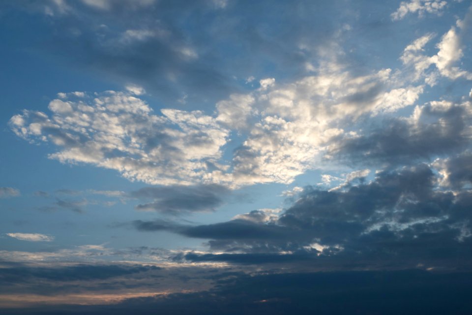 Mixed clouds over setting sun