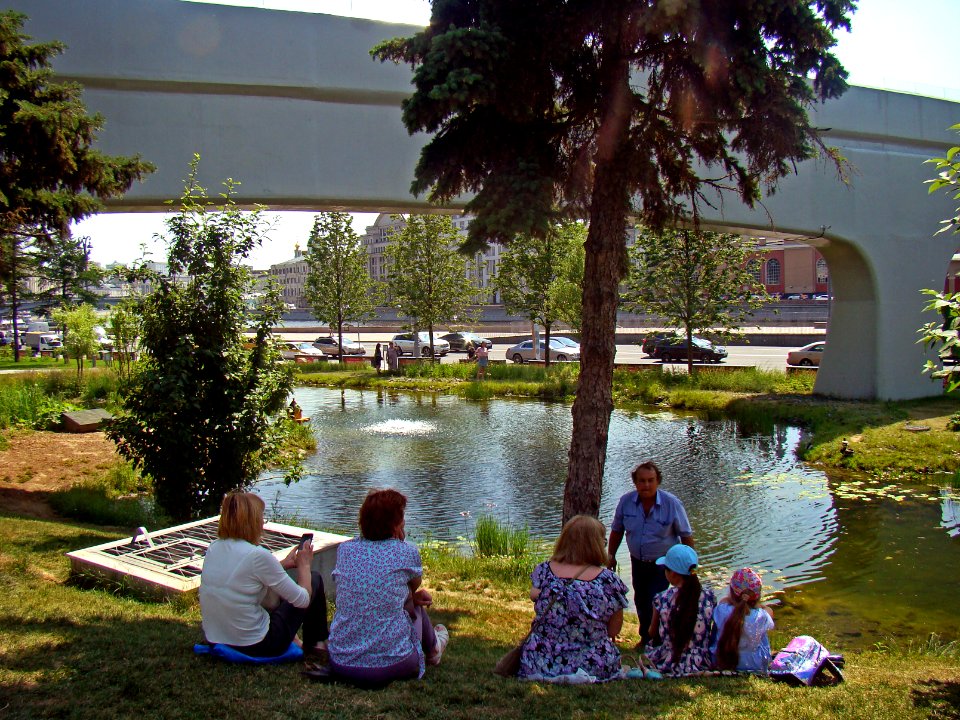 Moscow. People are resting near the pond in Zaryadye Park