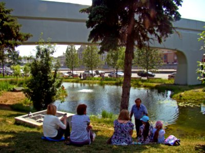 Moscow. People are resting near the pond in Zaryadye Park