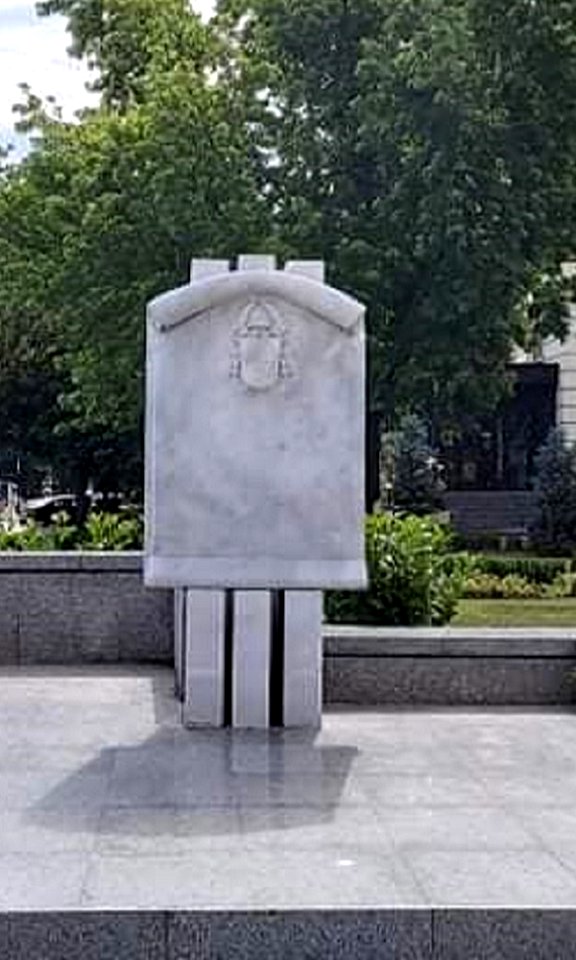 Monument with the coat of arms of Pope John Paul on the central square in Plovdiv