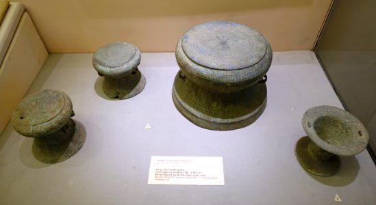Miniature drums (1) and urn (2) for funerary use, Dong Son culture, c. 2500-2000 years before present, bronze - National Museum of Vietnamese History - Hanoi, Vietnam - DSC05469