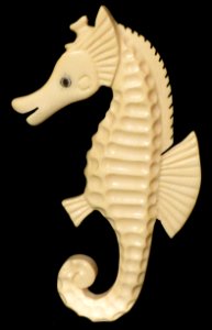 Ming's White Ivory Seahorse Brooch with gemstone eye