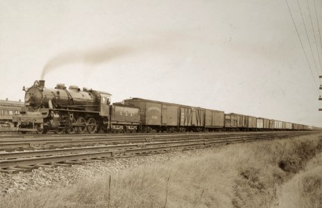 Military Administration - Transportation - Rail - Rolling Stock - 23 ' X 26' Locomotive, built for the War Dept. by the American Locomotive Co., N. Y. City hauling a string of cars , in a test run - NARA - 45501885 (cropped)