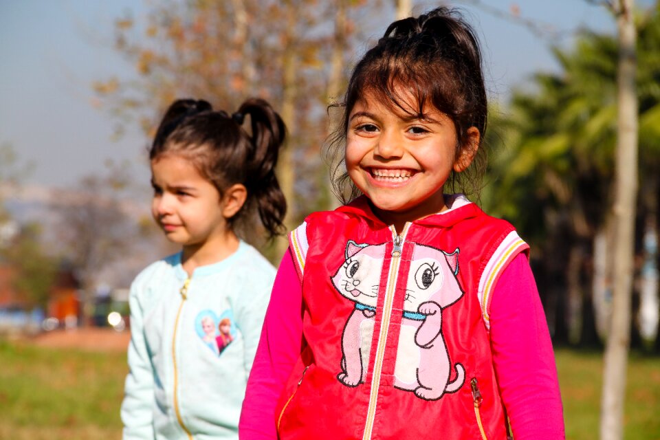 Smiley crying girls kids playing photo