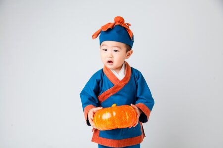 Costume child cute little boy get the pumpkin kids