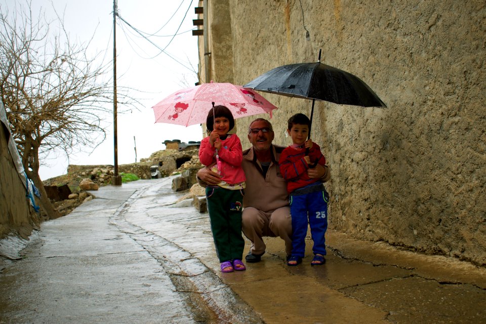 Nasir, the gatekeeper of the Shrine of Nahum in alQosh, with his kids