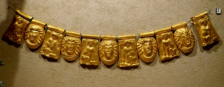 Necklace of stamped pendants of crouching sphinxes and women's faces, c. mid 4th century BC, gold, inv. 13194 - Museo Gregoriano Etrusco - Vatican Museums - DSC01137