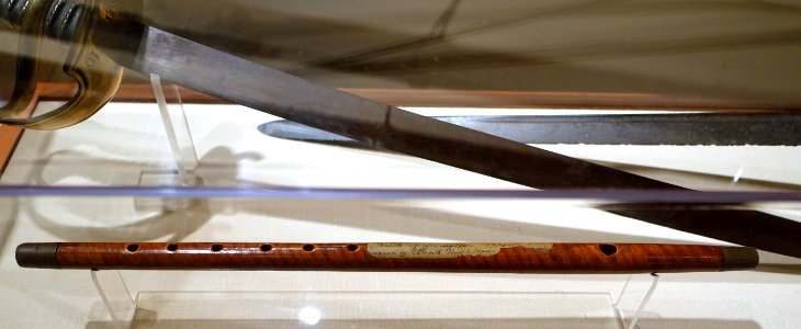 Naval cutlass owned by Col. James Barrett, England, c. 1750, steel, with fife said to have been played at 1775 Lexington fight, England or America, 1750-1770, maple - Concord Museum - Concord, MA - DSC05581