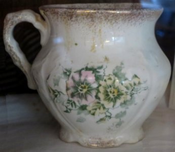 Mug with pink and yellow flower design, La Belle China, Bailey House Museum